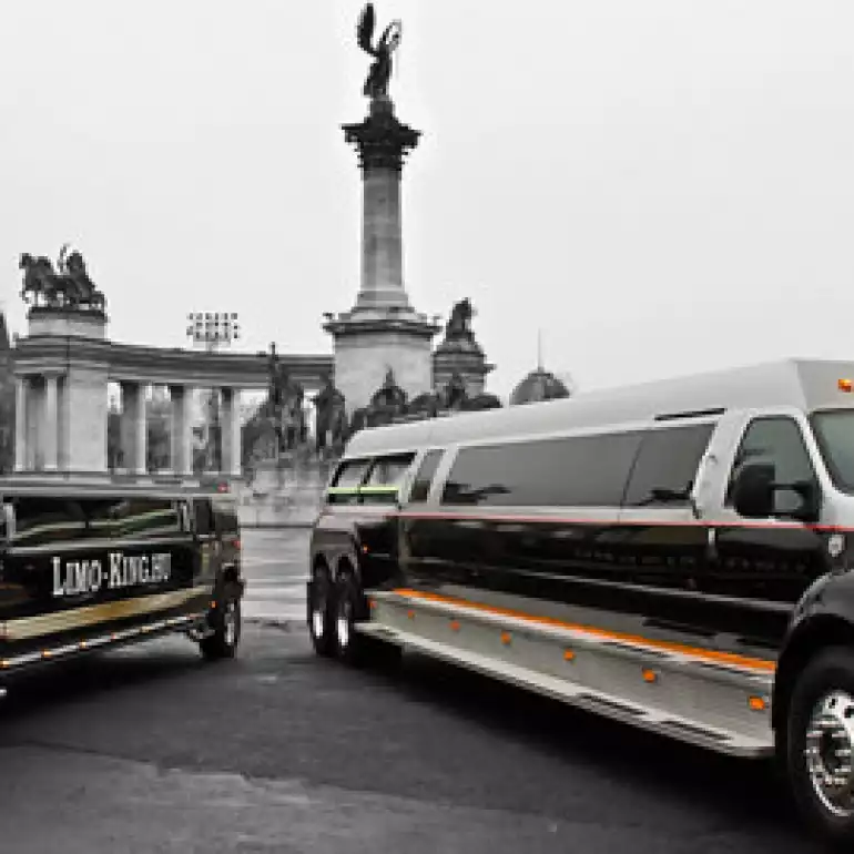 The famous Budapest Big Daddy limousine standing next to a regular luxury hummer limo.