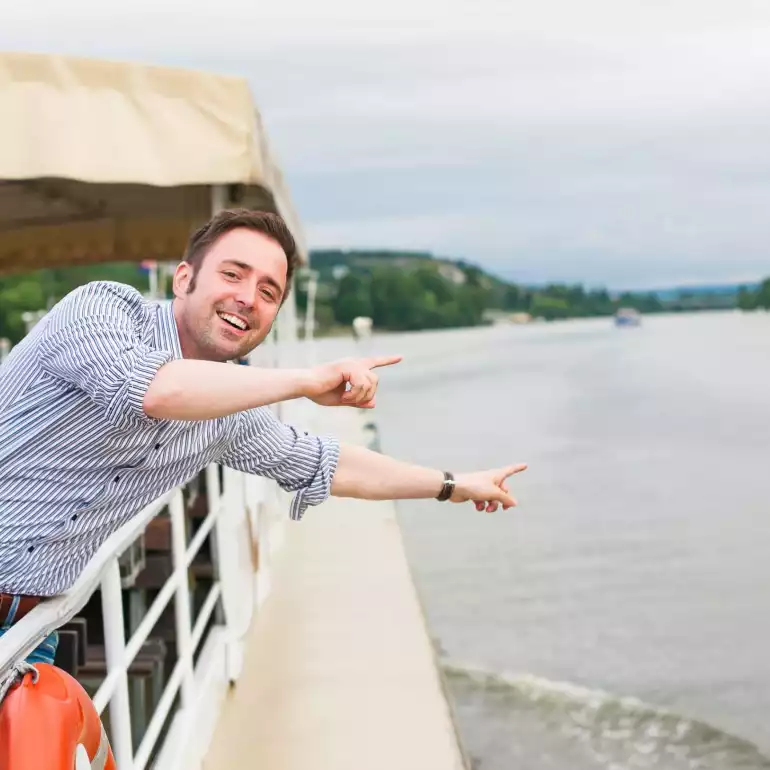A guy enjoying a river-cruise in Budapest.