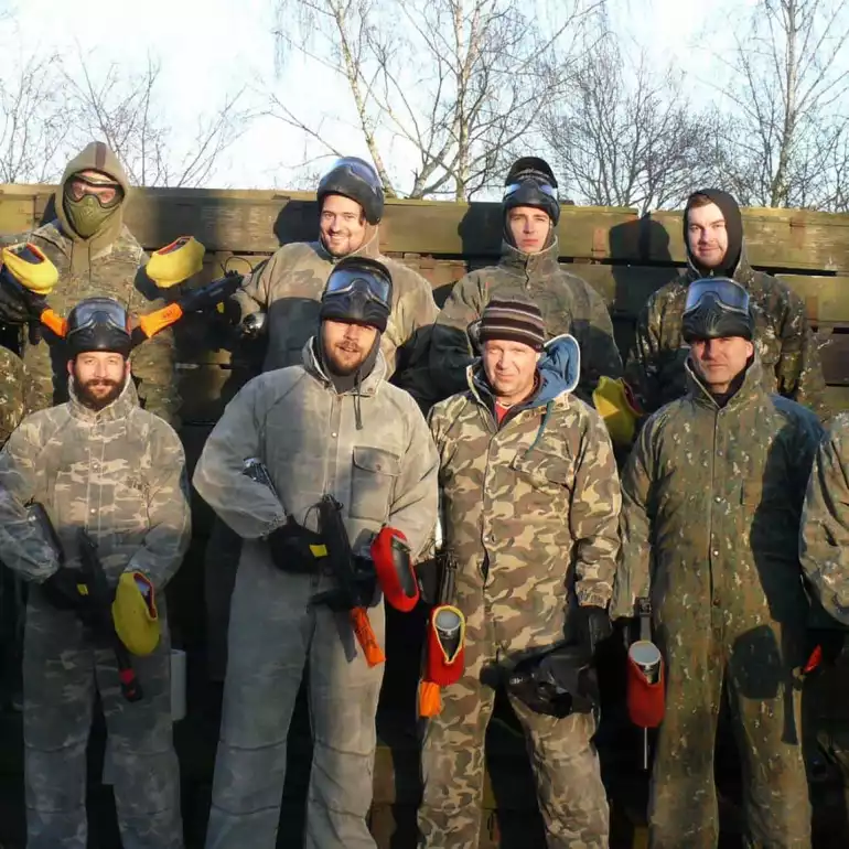 Bachelor party group posing after their paintball game in Budapest.